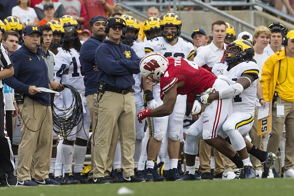 Don Brown, Jim Harbaugh, and Nico Collins (4)