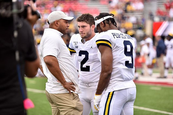 Josh Gattis, Shea Patterson (2), and Donovan Peoples-Jones (9)