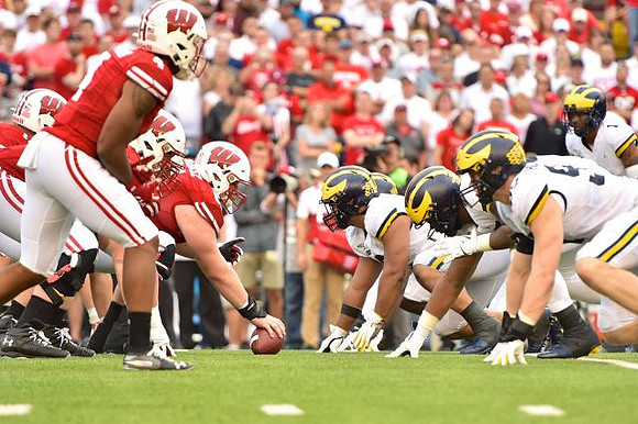 Aidan Hutchinson (97) and Ambry Thomas (1)