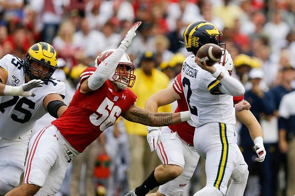 Jon Runyan Jr. (75) and Shea Patterson (2)