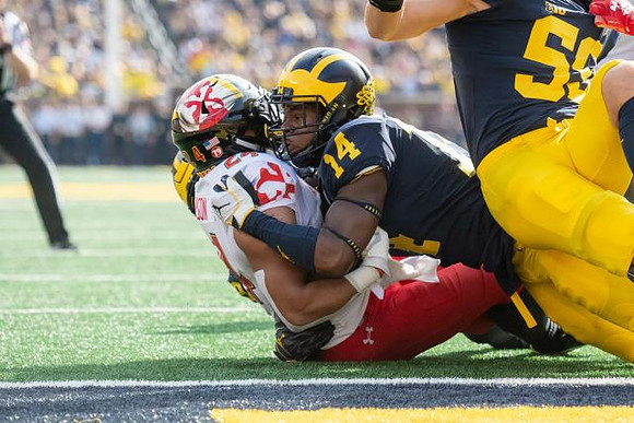 Josh Metellus (14) and Noah Furbush (59)