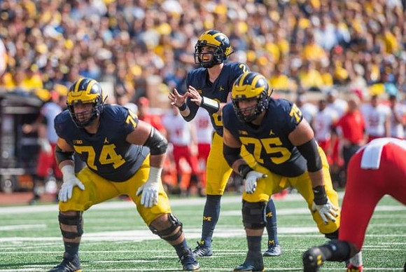 Ben Bredeson (74), Shea Patterson (2), and Jon Runyan Jr. (75)
