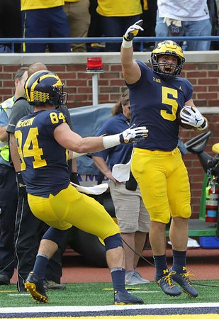 Sean McKeon (84) and Jared Wangler (5)