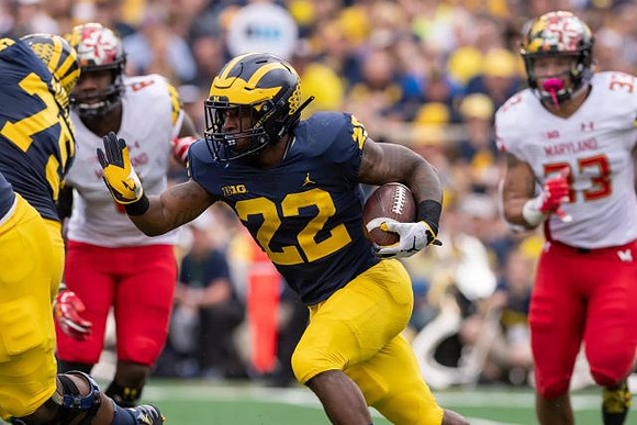 Jon Runyan Jr. (75) and Karan Higdon (22)
