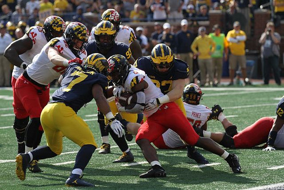 Khaleke Hudson (7), Lawrence Marshall (93), and Aidan Hutchinson (97)