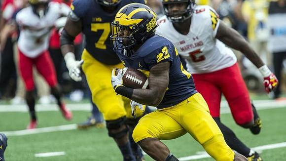 Karan Higdon (22) and Juwann Bushell-Beatty (76)