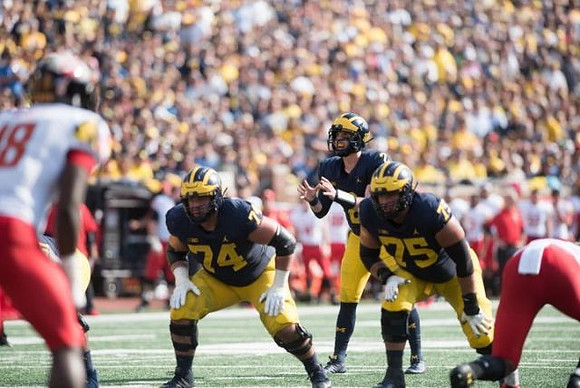Ben Bredeson (74), Shea Patterson (2), and Jon Runyan Jr. (75)
