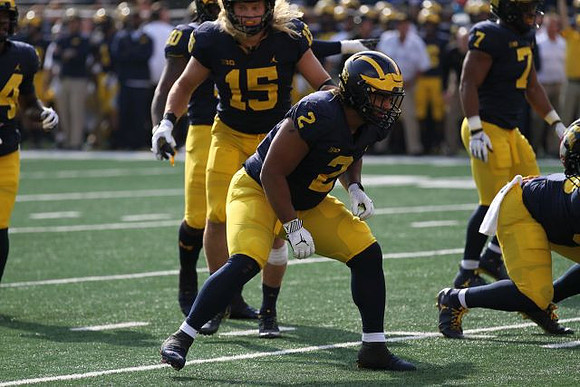 Bryan Mone (90), Chase Winovich (15), Carlo Kemp (2), and Khaleke Hudson (7)