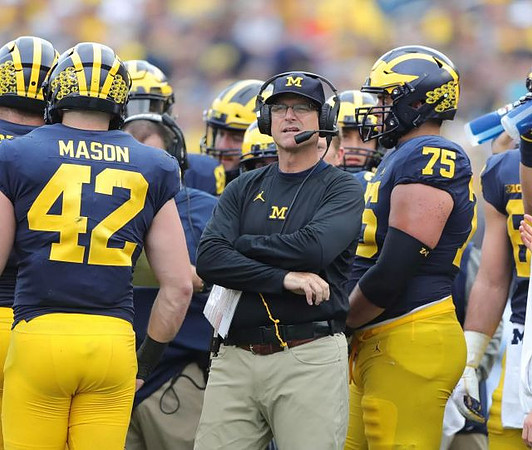 Ben Mason (42), Jim Harbaugh, and Jon Runyan Jr. (75)
