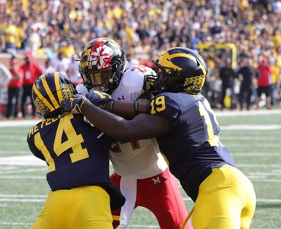 Josh Metellus (14) and Kwity Paye (19)