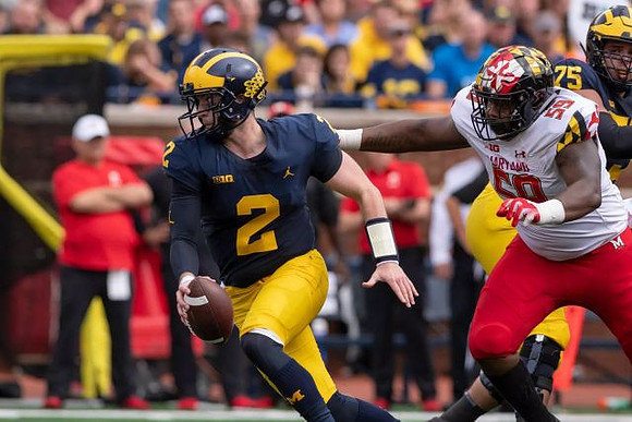 Shea Patterson (2) and Jon Runyan Jr. (75)