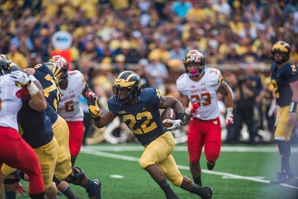 Jon Runyan Jr. (75), Karan Higdon (22), and Shea Patterson (2)