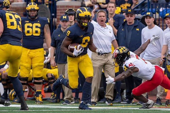 Zach Gentry (83), Karan Higdon (22), and Chuck Filiaga (66)
