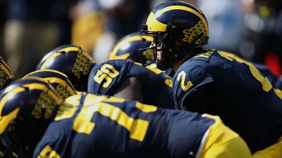 Jon Runyan Jr. (75), Michael Onwenu (50), and Shea Patterson (2)