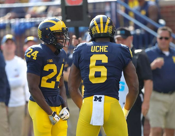 Lavert Hill (24) and Josh Uche (6)