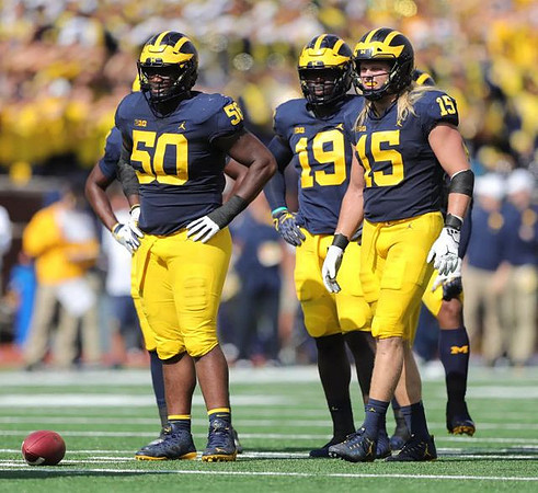 Michael Dwumfour (50), Kwity Paye (19), and Chase Winovich (15)