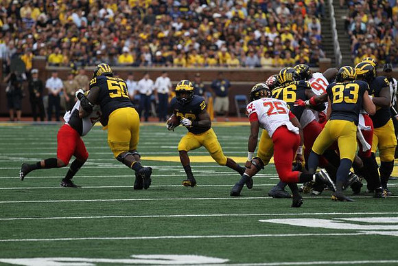 Michael Onwenu (50), Karan Higdon (22), Juwann Bushell-Beatty (76), Zach Gentry (83), and Cesar Ruiz (51)