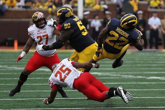 Michael Onwenu (50) and Karan Higdon (22)
