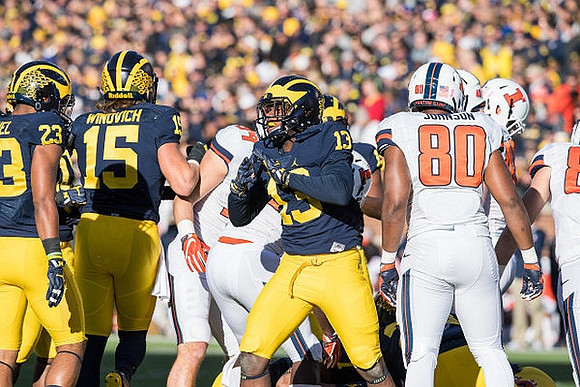 Tyree Kinnel (23), Chase Winovich (15), and Eddie McDoom (13)