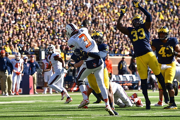 Mike McCray (9), Taco Charlton (33), and Chris Wormley (43)
