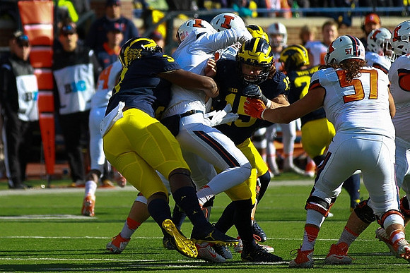 Rashan Gary (3) and Chase Winovich (15)
