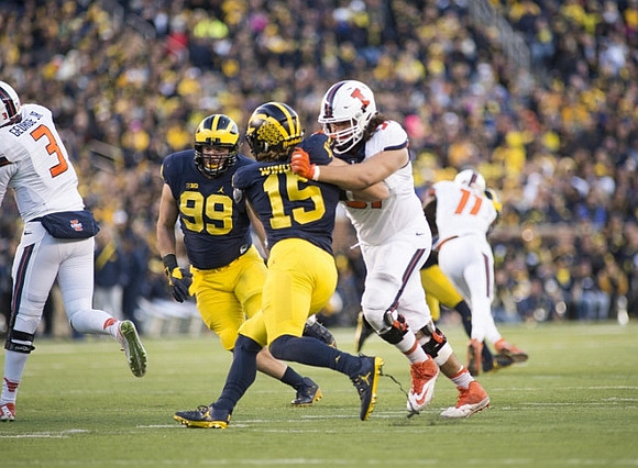 Matthew Godin (99) and Chase Winovich (15)