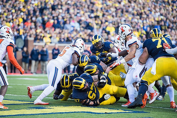 Kyle Kalis (67), Tyrone Wheatley Jr. (17), Erik Magnuson (78), Khalid Hill (80), and Ben Braden (71)