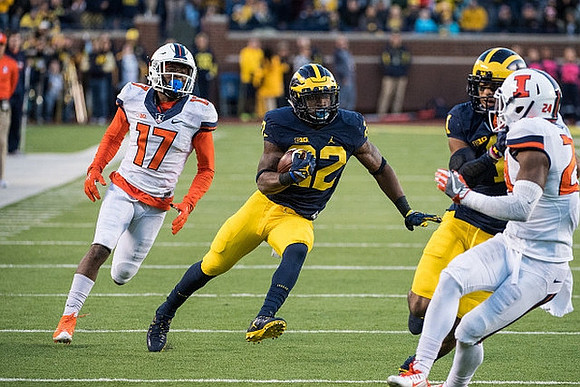 Karan Higdon (22) and Kekoa Crawford (1)