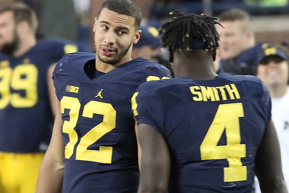 Ty Isaac (32) and De'Veon Smith (4)