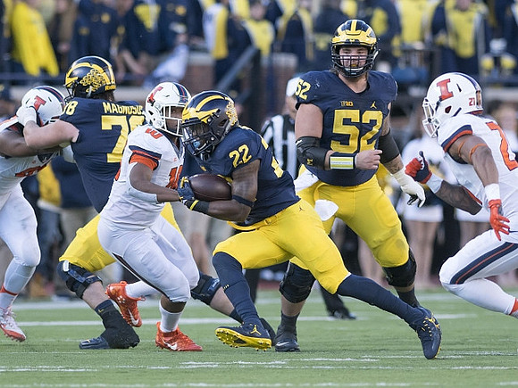 Erik Magnuson (78), Karan Higdon (22), and Mason Cole (52)