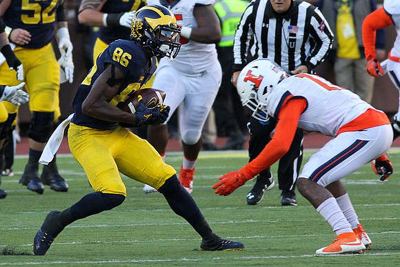 Mason Cole (52) and Jehu Chesson (86)