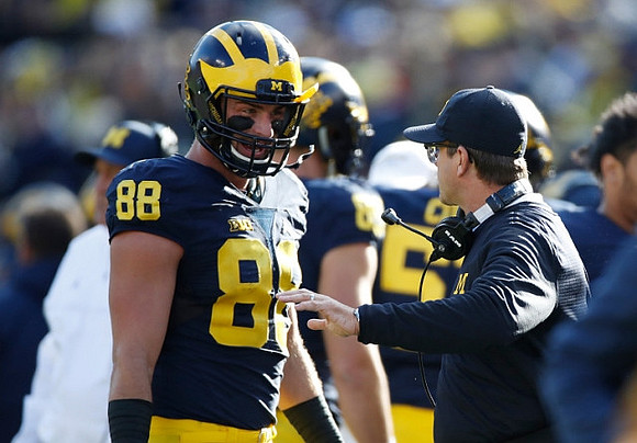 Jake Butt (88) and Jim Harbaugh