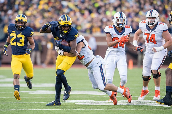 Tyree Kinnel (23) and Dymonte Thomas (25)