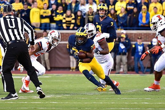 Karan Higdon (22) and Wilton Speight (3)