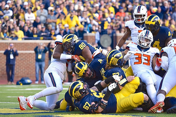 Kyle Kalis (67), Henry Poggi (19), Mason Cole (52), Khalid Hill (80), and De'Veon Smith (4)