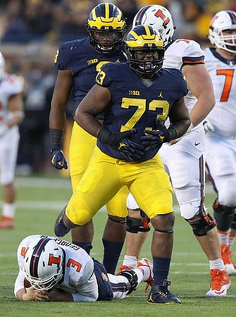 Rashan Gary (3) and Maurice Hurst (73)