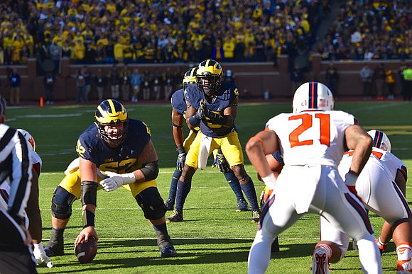 Mason Cole (52) and Jabrill Peppers (5)