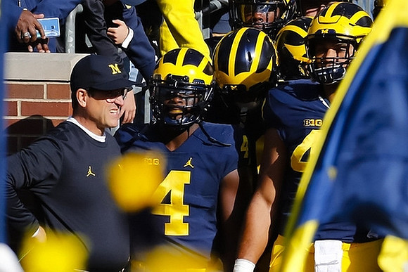 Jim Harbaugh, De'Veon Smith (4), and Chris Wormley (43)