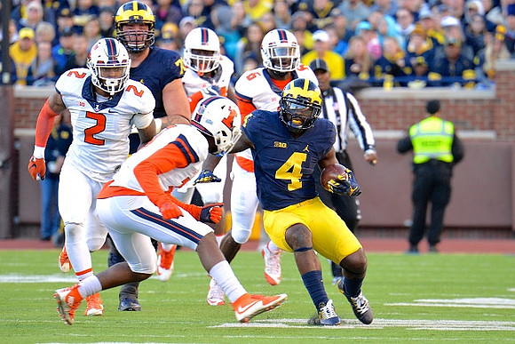 Ben Braden (71) and De'Veon Smith (4)