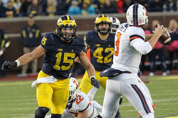 Chase Winovich (15) and Ben Gedeon (42)