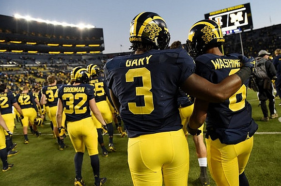 Louis Grodman (32), Rashan Gary (3), and Keith Washington (6)