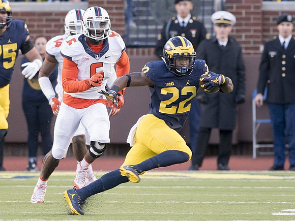 Jon Runyan Jr. (75) and Karan Higdon (22)