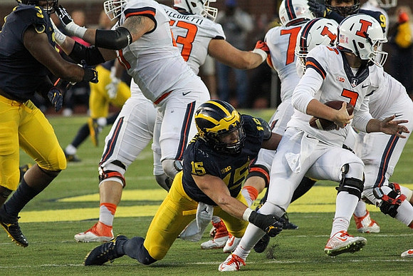 Rashan Gary (3) and Chase Winovich (15)