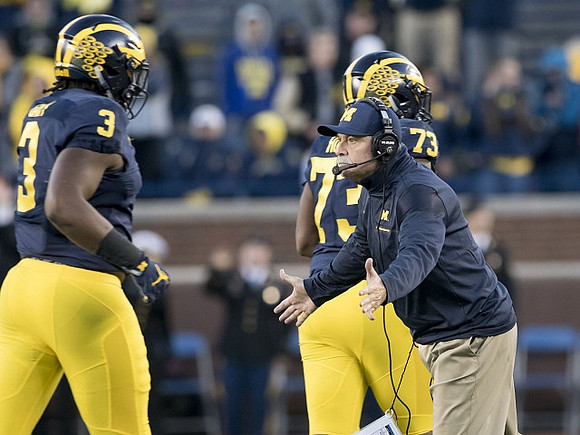 Rashan Gary (3), Don Brown, and Maurice Hurst (73)