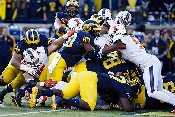Ben Bredeson (74), Khalid Hill (80), Tyrone Wheatley Jr. (17), and Erik Magnuson (78)