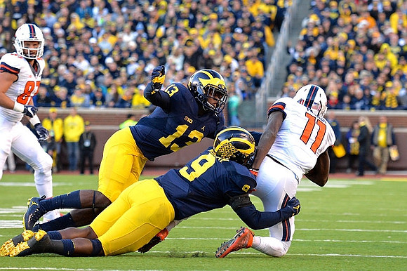 Eddie McDoom (13) and Mike McCray (9)