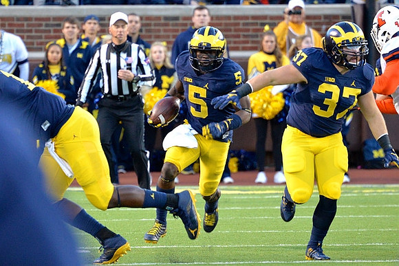Jabrill Peppers (5) and Bobby Henderson (37)