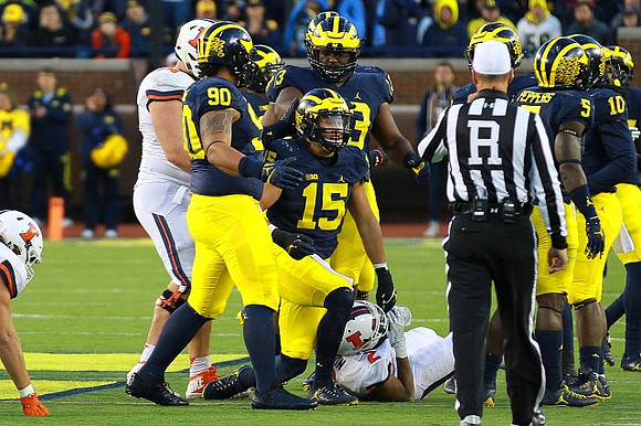 Bryan Mone (90), Chase Winovich (15), Taco Charlton (33), Jabrill Peppers (5), and Devin Bush (10)