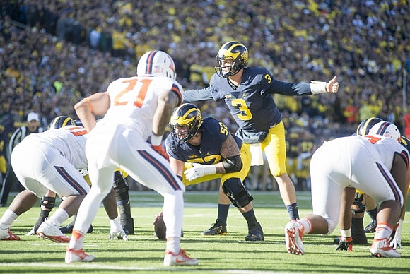 Mason Cole (52) and Wilton Speight (3)