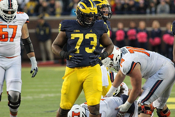 Maurice Hurst (73) and Chase Winovich (15)